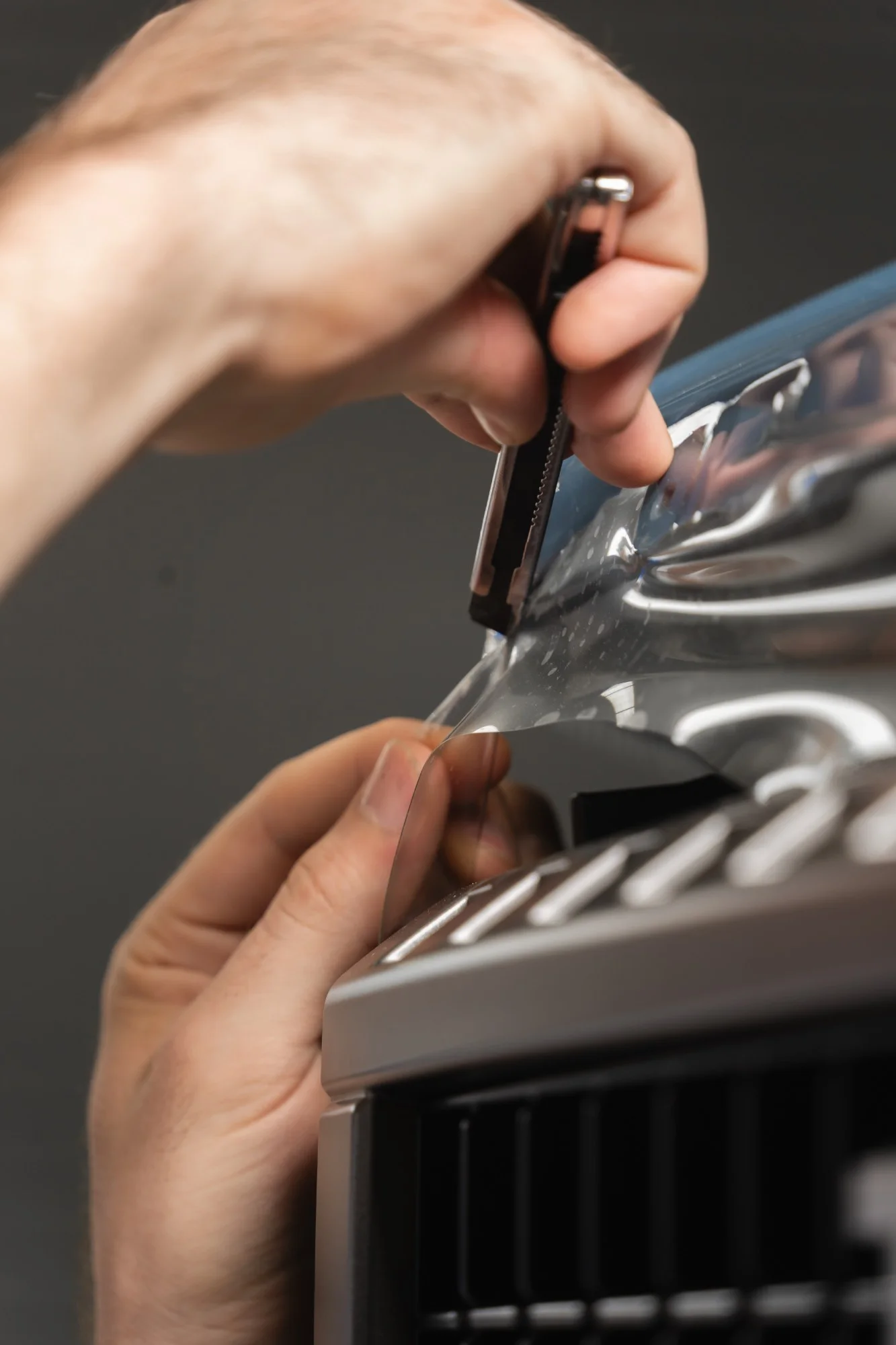 Paint Protection Film being installed by hand